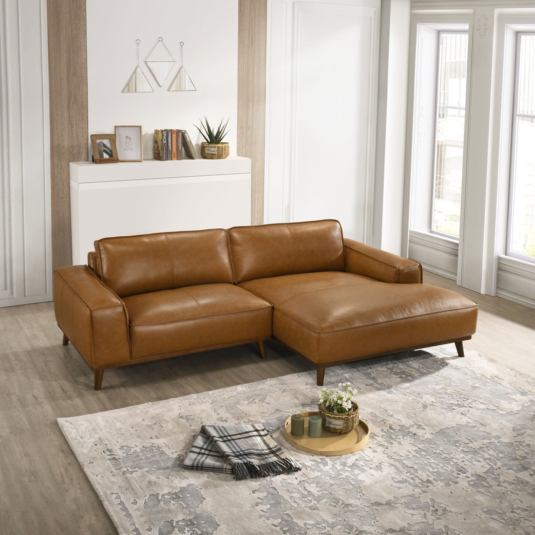 Créa de publicité catalogue Facebook de Wayfair : un canapé d'angle en L Blayke en cuir fauve dans un salon moderne et lumineux